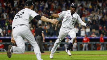 Elias Diaz of the Colorado Rockies celebrates with Brendan Rodgers