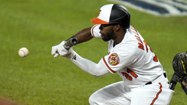 Marlins outfielder Juan Pierre bunting for a hit.