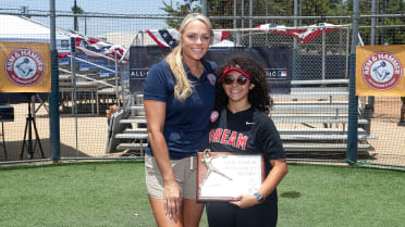 L-R) Jennie Finch and Bad Bunny at the 2022 MLB All-Star Celebrity Softball  Game Media Availability held at the 76 Station - Dodger Stadium Parking Lot  in Los Angeles, CA on Saturday, ?