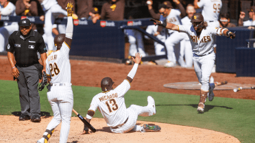 Cleveland, Ohio. 4th May, 2022. San Diego Padres third baseman Manny Machado  (13) hits a two-run homerun in the third inning during game one of an MLB  doubleheader against the Cleveland Guardians