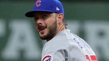 Chicago Cubs third baseman Kris Bryant blows bubblegum while returning to  the dugout during the second inning while playing the Cleveland Indians in  the annual Big League Weekend baseball game at …