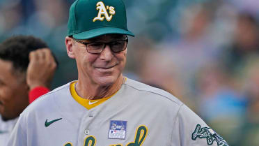 Oakland Athletics manager Bob Melvin, left, talks with draft pick Max Muncy  before a baseball game between the Athletics and the Los Angeles Angels in  Oakland, Calif., Monday, July 19, 2021. (AP