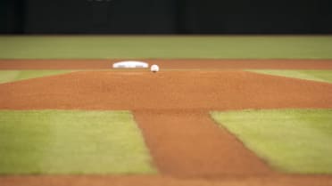 Long toss: Frustrated Trevor Bauer heaves ball over outfield wall