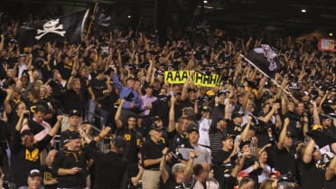 Pittsburgh Pirates fans raise the Jolly Roger as they cheer in the 9th  inning of game 3 of the NLDS against the St. Louis Cardinals at PNC Park in  Pittsburgh, Pennsylvania on