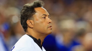 Why was Roberto Alomar banned from the MLB?