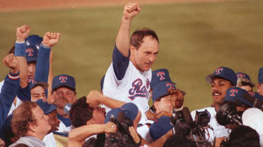 Former Texas Rangers catcher Jim Sundberg acknowledges cheers from fans as  he is introduced during a Rangers alumni legacy baseball game in Arlington,  Texas, Friday, Aug. 11, 2006. Sundberg played for the