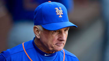 New York Mets manager Terry Collins, left, pulls relief pitcher