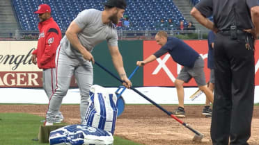 Phillies grounds crew uses blowtorch on field