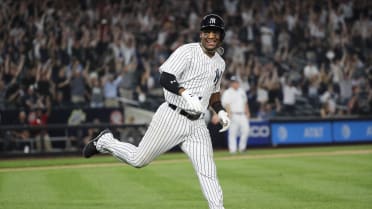 Yankees' Miguel Andujar practices fielding baseballs off the Green