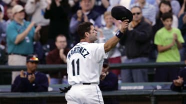 Former Seattle Mariners players Edgar Martinez, facing, greets Ken Griffey  Jr. (24) as they prepare to throw out ceremonial first pitches during the  MLB All-Star baseball game in Seattle, Tuesday, July 11