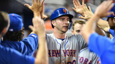 Alonso wears catcher's gear in the dugout 