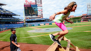 A person walks toward the Philadelphia Phillies team store at Citizens Bank  Park on Monday, Jul …