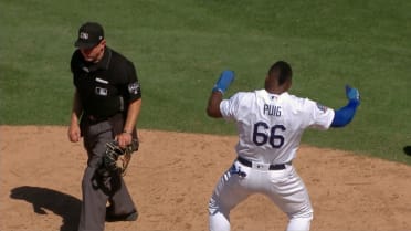 After Yasiel Puig tried and failed to avoid Javy Baez's tag, Baez teased  him and they both laughed