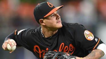 Baltimore Orioles' Manny Machado smiles after teammate Adam Jones hit him  in the face with a pie after a baseball game against the Oakland Athletics  in Baltimore, Wednesday, Aug. 23, 2017. (AP