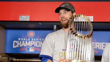 Chicago Cubs outfielder BEN ZOBRIST holds up his MVP trophy - Gold