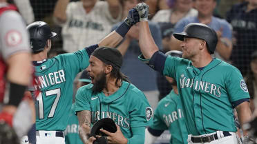 Mitch Haniger of the Seattle Mariners reacts after hitting a two-run single  in the eighth inning of a game against the Los Angeles Angels on Oct. 2,  2021, at T-Mobile Park in