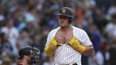 Luke Voit rips his jersey open after scoring from first on a Mike