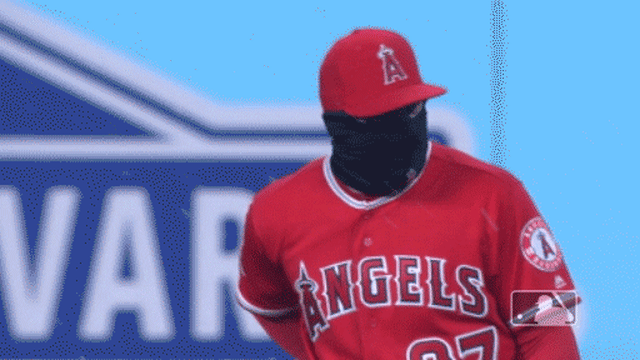 Mike Trout tries to stay warm