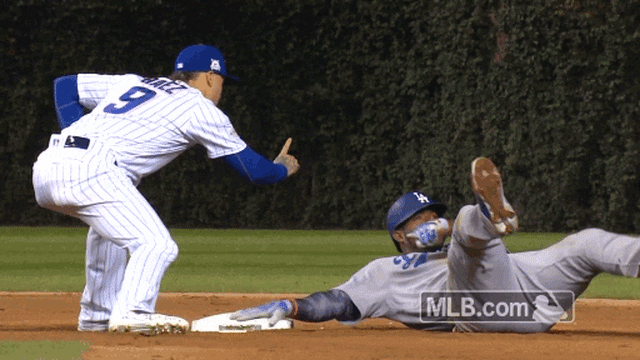 After Yasiel Puig tried and failed to avoid Javy Baez's tag, Baez teased  him and they both laughed