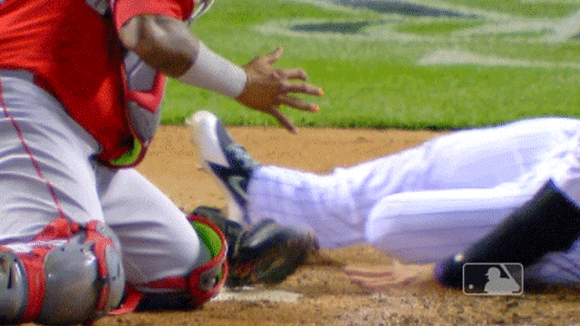 This throw beat Martin Maldonado to the plate, so he used a perfect swim  slide to avoid the tag
