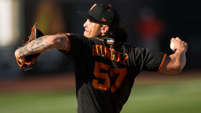 Pitcher Dereck Rodriguez matched his father, Pudge, with a hit in