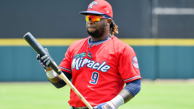 Jose Altuve couldn't resist the appeal of Taylor Motter's long blond locks  and just had to get a feel