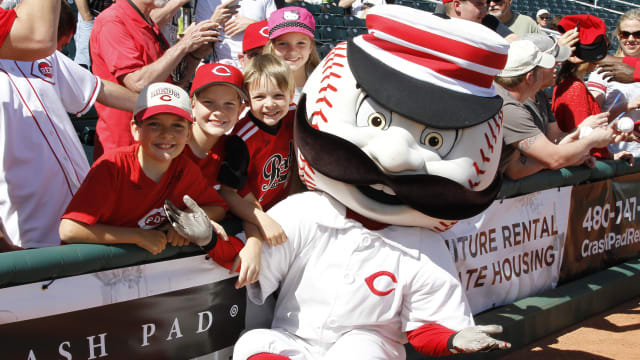 Cincinnati Reds mascot Mr. Redlegs with the Ohio Cup prior to a