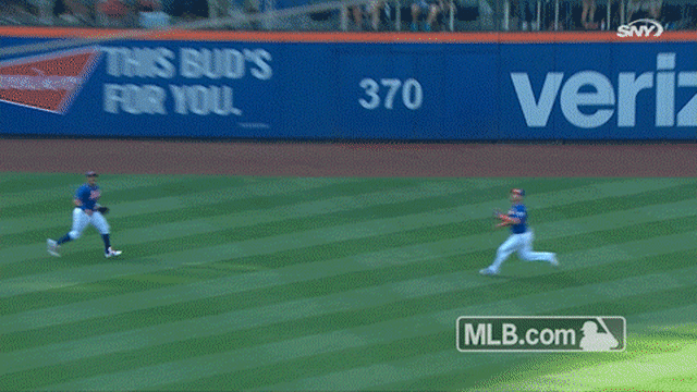 Yoenis Cespedes bobbles before making the catch