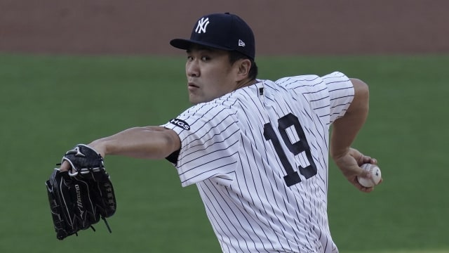 Yankees pitcher Masahiro Tanaka returns to Japan with his family