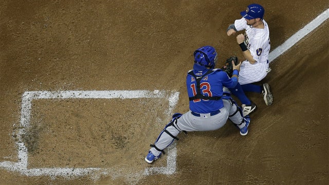 Catcher Jett Bandy of the Milwaukee Brewers sets to throw to first