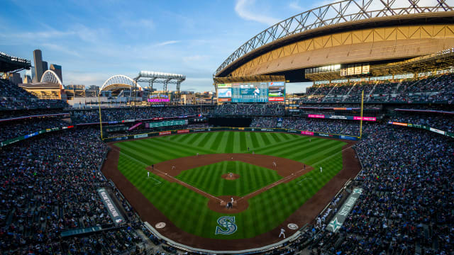 Believe signs are shown on a video display at T-Mobile Park during a  baseball game between the Seattle Mariners and the Oakland Athletics,  Wednesday, Sept. 29, 2021, in Seattle. Fans and the