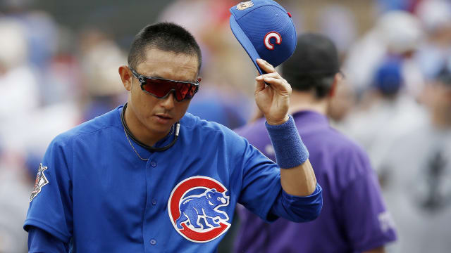 TORONTO, ON- JUNE 22 - Munenori Kawasaki adjusts his helmet as the News  Photo - Getty Images