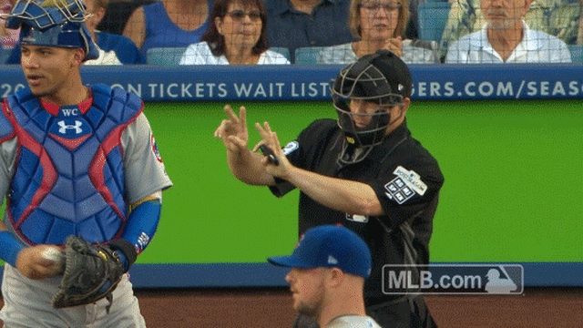 Umpire Todd Tichenor reminds Enrique Hernandez of the correct count