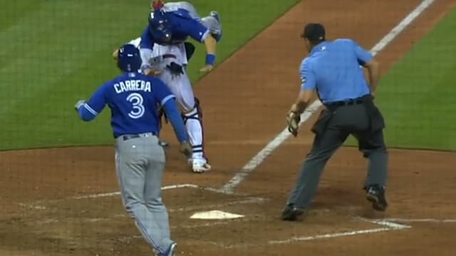 VIDEO: Blue Jays' Chris Coghlan flips over Yadier Molina during