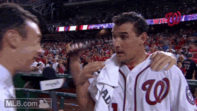 Washington Nationals Max Scherzer can only smile as he is drenched in  celebratory chocolate syrup after pitching a no-hitter against the  Pittsburgh Pirates at Nationals Park on June 20, 2015 in Washington