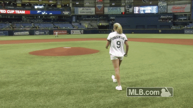 Coco Vandeweghe serves first pitch with tennis racket