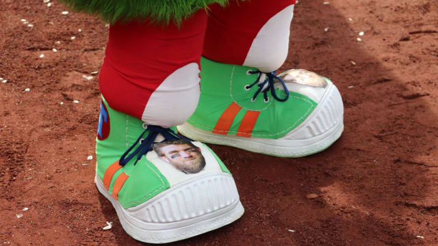 The Phillie Phanatic dressed John Kruk as a gladiator during a broadcast