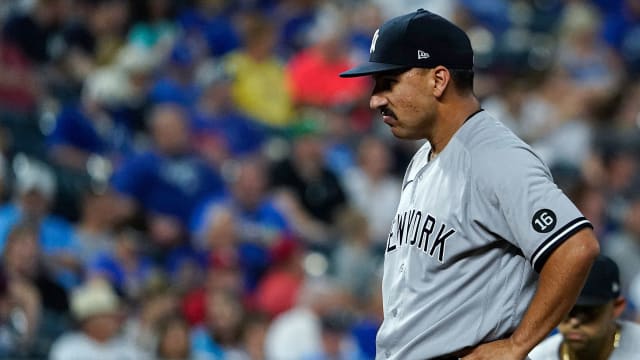 CLEARWATER, FL - MARCH 25: Kyle Higashioka (66) of the Yankees talks with  his pitcher during the spring training game between the New York Yankees  and the Philadelphia Phillies on March 25