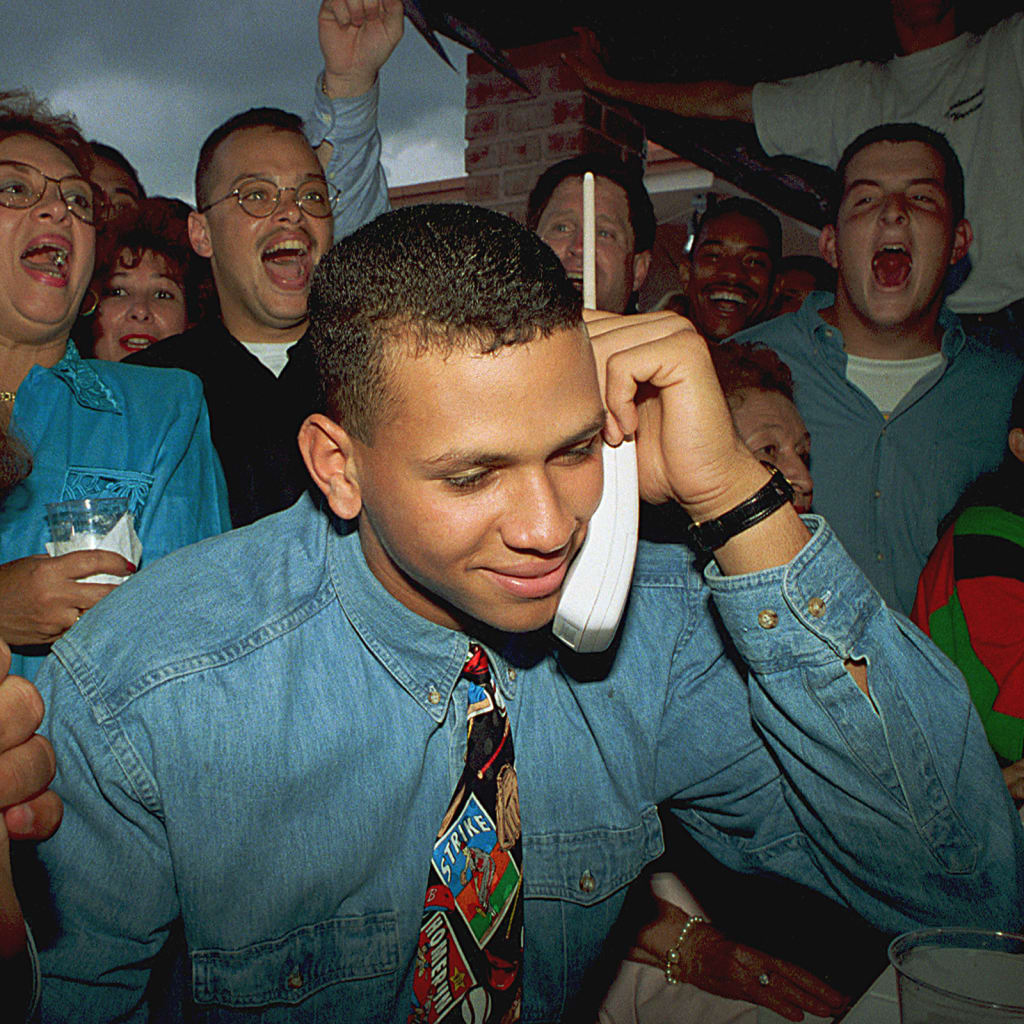 In a different world, A-Rod and his baseball-themed tie would have been accepting a call from the Dodgers and not the Mariners. (AP)