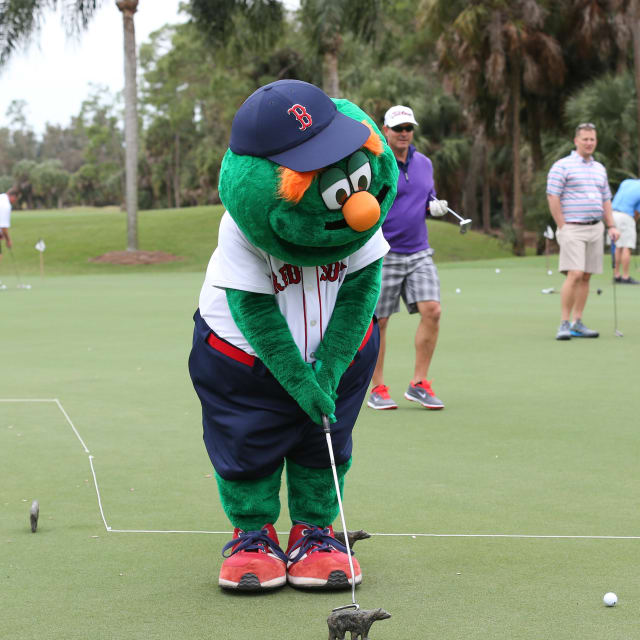 Boston Red Sox mascot Tessie The Green Monster performs on the infield  before a spring training baseball game against the Baltimore Orioles on  Thursday, March 17, 2016, in Fort Myers, Fla. (AP