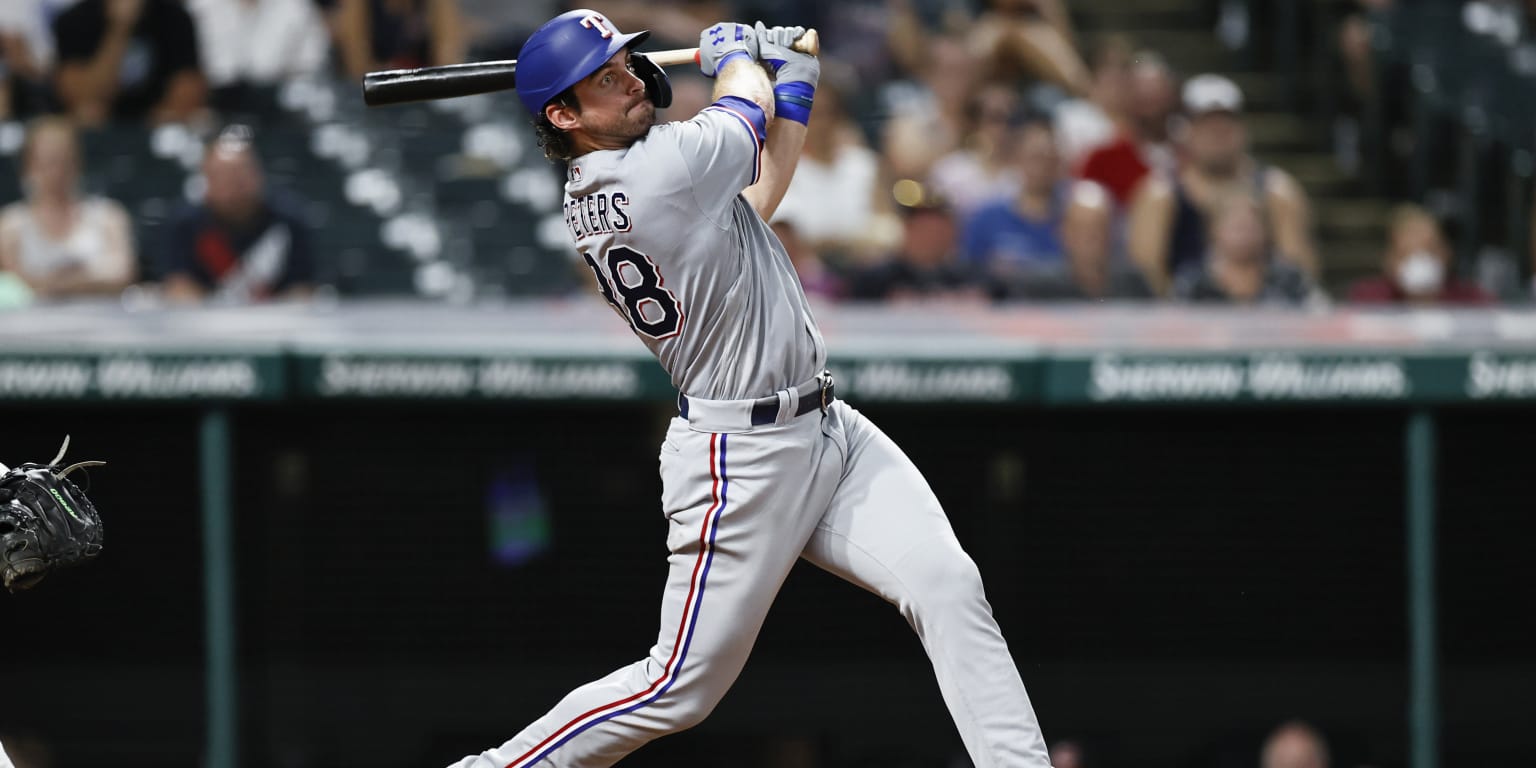 Texas Rangers designated hitter DJ Peters (38) reacts after flying