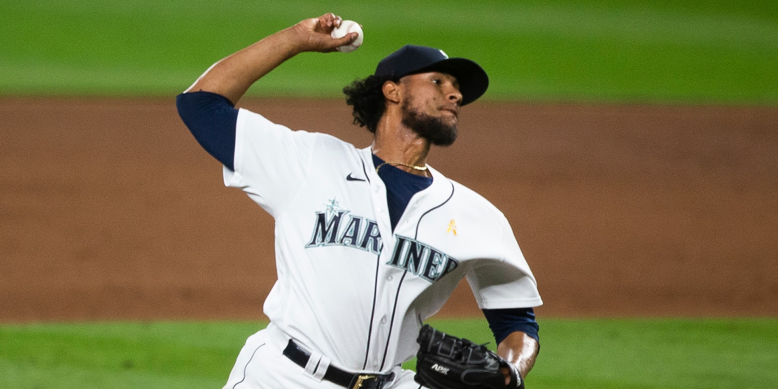 Seattle Mariners' Yohan Ramirez pitches during a spring training