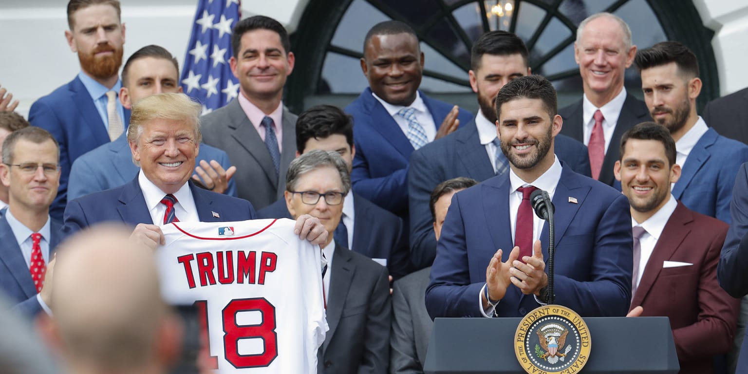 President Donald Trump receives a jersey with his name from Boston Red Sox J.D.  Martinez, Right Fielder, right, as he welcomes the 2018 World Series  Champions to the White House, The Boston