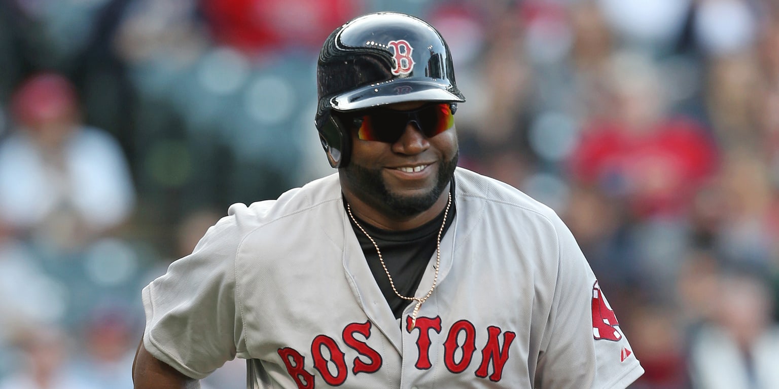 Photo: Boston Red Sox Kevin Youkilis and David Ortiz react at