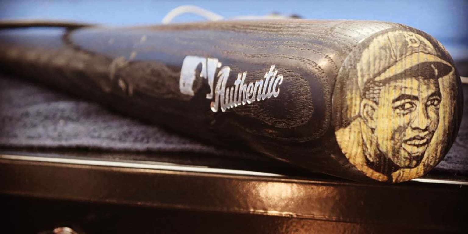 An artist designed baseball bats that feature Jackie Robinson's face on
