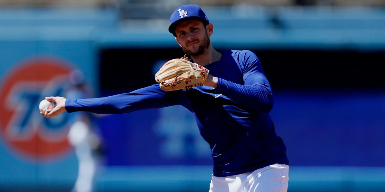 Infielder Trea Turner of the Los Angeles Dodgers throws a ball into