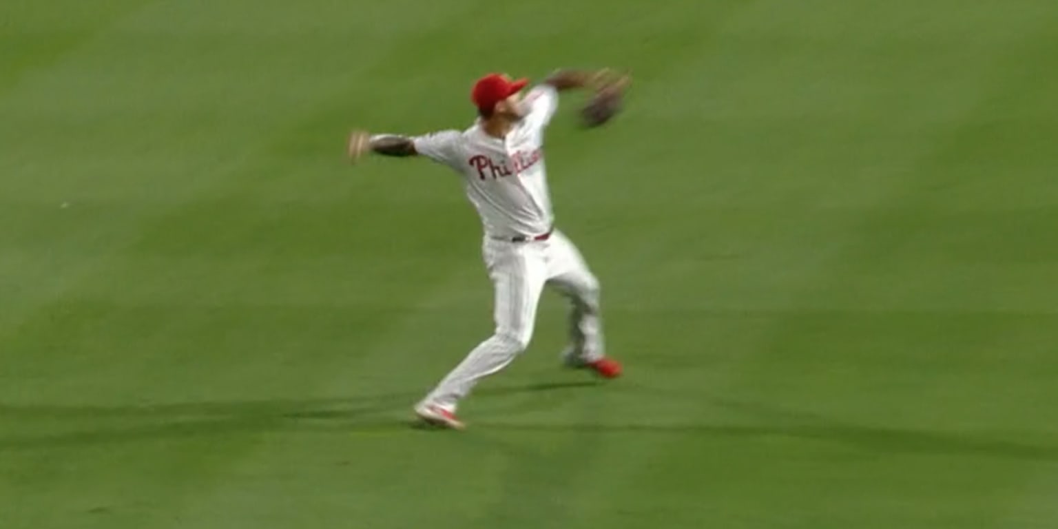 Pitcher Vince Velasquez throws out runner at home from outfield