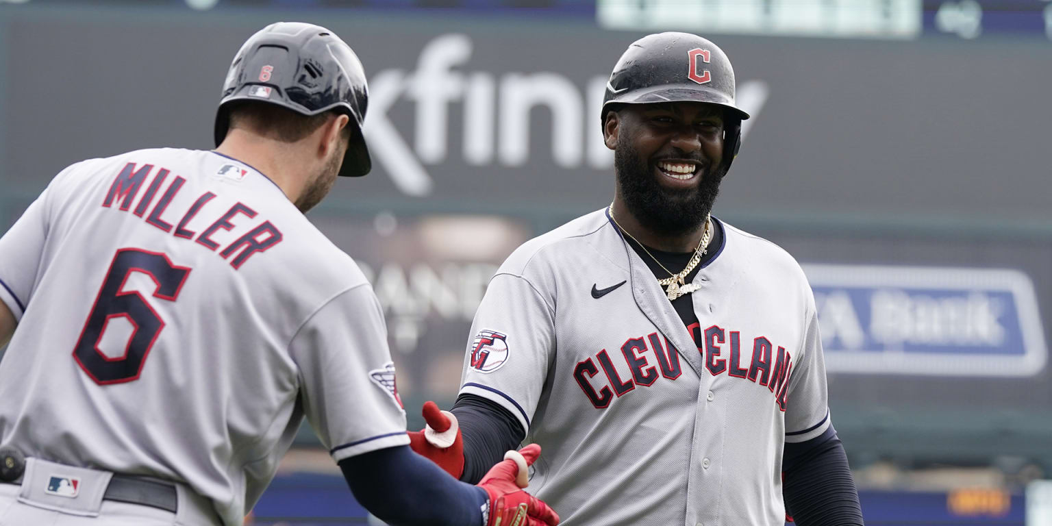 Chicago Cubs' Franmil Reyes laughs as he runs the bases after hitting a  two-run home run during the eighth inning of the team's baseball game  against the Cincinnati Reds in Cincinnati, Wednesday