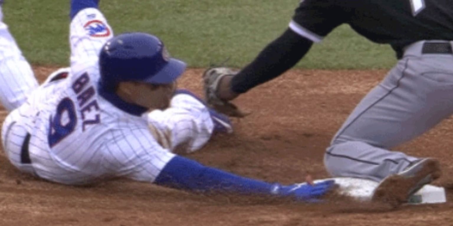 Puerto Rico's Javier Báez steals third base and magically avoids