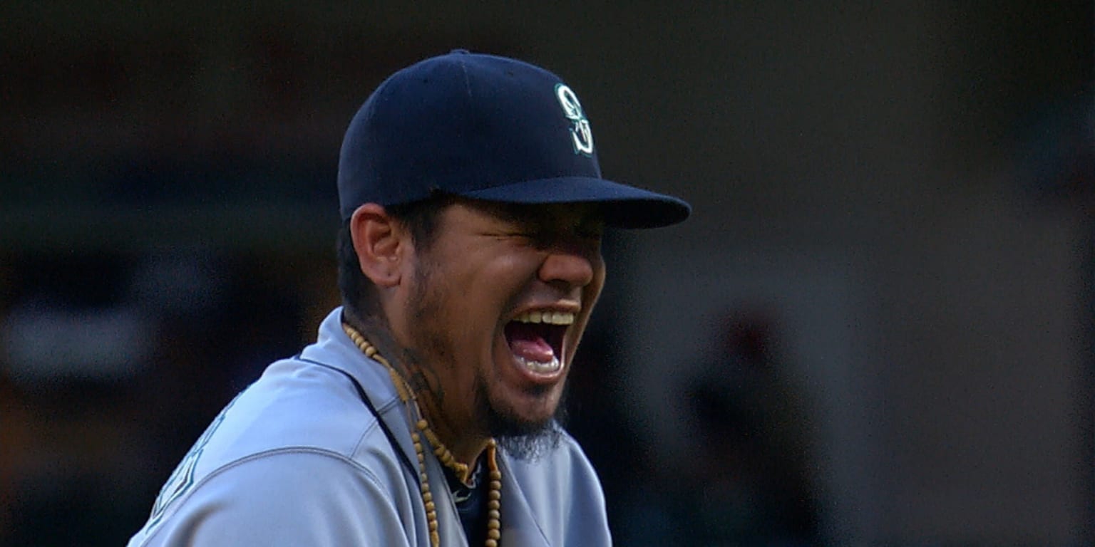 Former baseball player Adrian Beltre, left, greets former teammate Félix  Hernández after he was inducted into the Mariners Hall of Fame during a  ceremony before a baseball game between the Mariners and